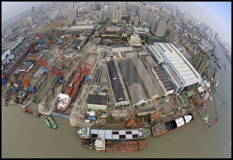 Situated on on left rim of Huang Pu river, on southern neighbourhoods of center Shanghai, the Jiang Nan shipyardis the oldest harbour in whole China, builded by Great Britain in the 1850's. It will be destroyed by 2006-2007 to be replaced by Shanghai 2010 World Exhibition installations. On background, habitation towers  of 'Puxi