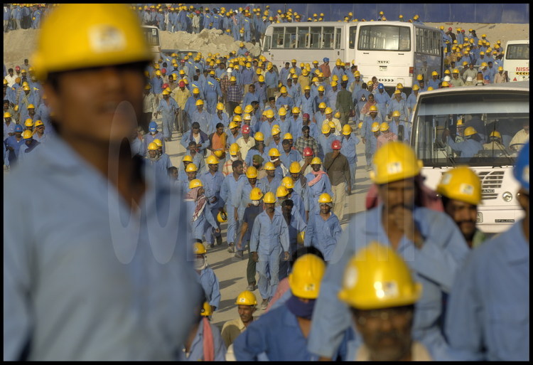 About 5000 construction workers mostly from India and Pakistan work daily on the Burj Dubai Tower complex construction site as well as on neighboring sites (mall, etc).  
They are paid about 1 dollar per hour rand are on site starting at dawn, working twelve-hour days.  The workers are housed and fed in “work camps” in the desert, half an hour’s bus ride from the city and send nearly all of their salaries to their families back home.