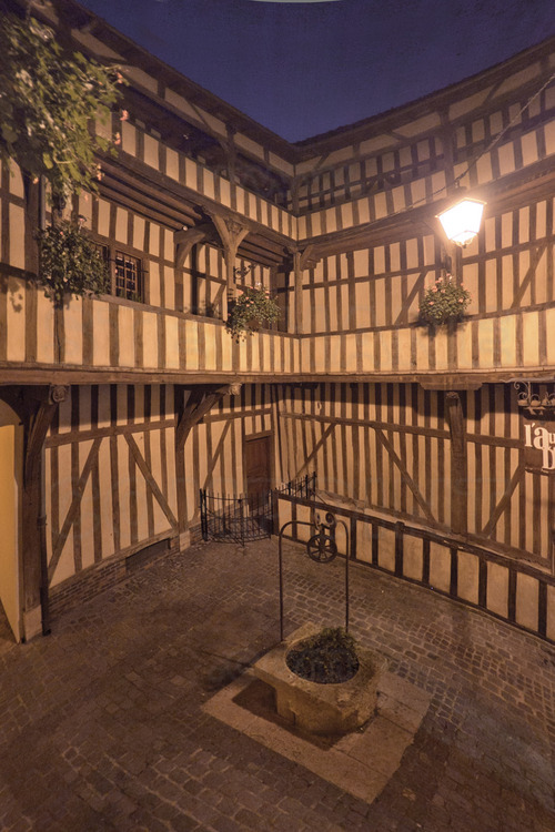 In the historical center, the courtyard of the Golden Mortar (cour du Mortier d'Or) at dusk.