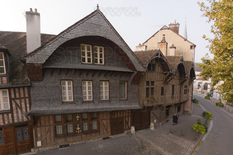 In the historical center, medieval houses in Passerat street. In the background, the church of Saint Remy.