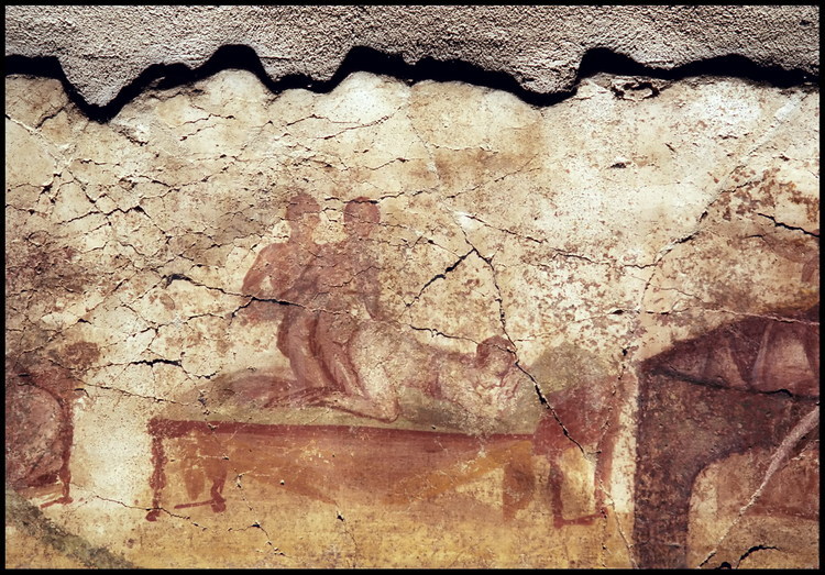 On one of the Porta Marina Suburban Baths dressing room walls, a painting depicts two men one behind the other, the first penetrating a young woman with light skin and a full backside.  This type of scene should not be shocking, as all types of sexual acts were commonly practiced.  The bath was a place to heal the body and to meet others.