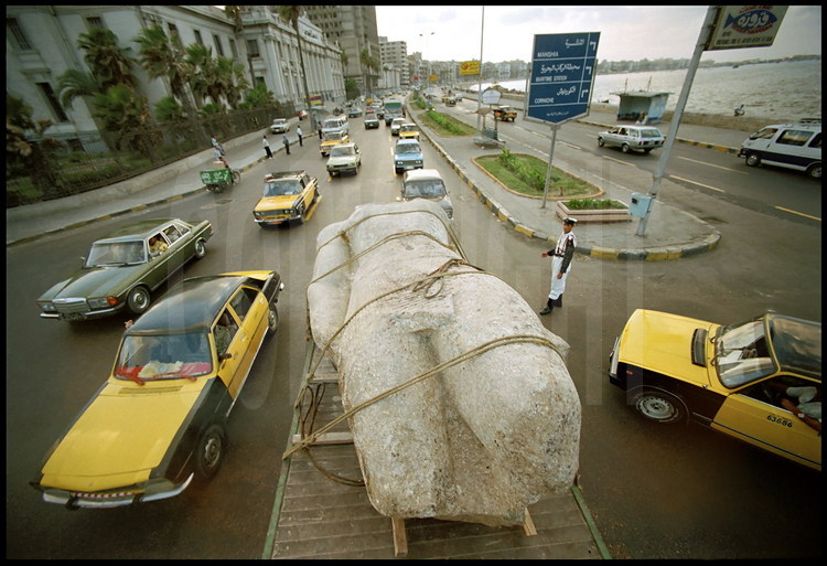 The colossal statue of King Ptolemy takes part in a procession at the Eastern Port of Alexandria before being placed in a desalination tank for six months.