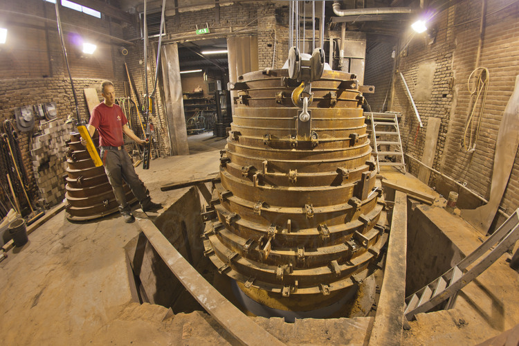 Asten, Netherlands. Royal Eijsbouts foundry, August 31, 2012. Wim Hurkmans, responsible for the foundry workshop, extract the mold of Mary (G sharp), a big bell of 6.2 tons intended to accompany the great bell Emmanuel in the southern Tower.