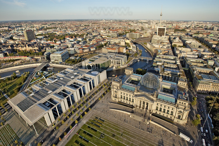 Reichstag and Bundestag. The wall's route lay along the eastern side of the Reichstag. Consequence of the reunification of Germany on 3 October 1990, the Bundestag (Federal Parliament of Germany) decided, a year later, to the Reichstag parliament building in Berlin, the restored capital of reunited Germany. After a complete restoration of the original building of 1894, the Bundestag meets in this place April 19, 1999, in a spectacularly restored building by Norman Foster. The Reichstag was plagued by damage and destruction during the 20th century. After reunification and the transfer of the Bundestag from Bonn to Berlin, it became necessary to equip and modernize the building down languishing. Architect Sir Norman Foster was commissioned to complete the mammoth project of transformation, including the now famous glass dome. The official reunification of Germany was celebrated here October 2, 1990. More recently, during the summer of 1995, Berliners and visitors from around the world flocked to enjoy the experience of the wrapping of the Reichstag by the artist Christo. The magical event lasted two weeks as a final farewell before the start of restoration work.