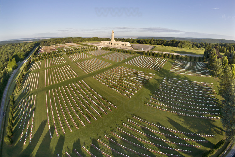 Battle of Verdun: French Cemetery of Fleury, which contains the graves of 16,142 soldiers. On the background, the National Necropolis (one of the four with those of Notre Dame de Lorette, Dormans and Old Armand) and Douaumont ossuary, which collects the bones of about 130,000 French and German unknown soldiers, gathered under the slab of a crypt 137 meters long. These memorials were built after the war on the very site of the battlefield of Verdun. It is here that on 22 September 1994, François Mitterrand and Helmut Kolh, hand in hand, have strengthened the Franco-German friendship.