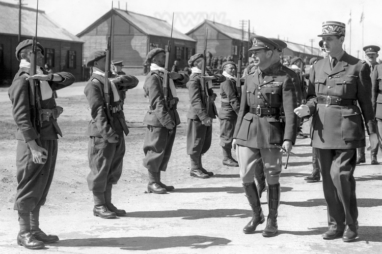 Normandie - Calvados (14) - Courseulles sur Mer : Site 10 : Juno Beach - Courseulles sur Mer. Site ou debarquerent le General de Gaulle, Winston Churchill, Eisenhower et le roi Georges VI. Situe entre Ver-sur-Mer et Saint-Aubin-sur-Mer, Juno Beach est le secteur de debarquement de la 3rd Canadian Infantry Division, commandee par le General Keller. Le 6 juin 1944, a 7 h 45, les chars amphibies du 1st Hussars sont mis a la mer a trois kilometres de la cote. Beaucoup sombrent a cause de la forte houle mais ceux qui abordent la plage ouvrent immediatement le feu sur les positions allemandes et permettent a la 7th Brigade de deboucher rapidement et de liberer Courseulles-sur-Mer en quelques heures. Au soir du 6 juin, 21 500 hommes et 3 200 vehicules ont debarque sur Juno Beach. Puis Winston Churchill debarqua ici le 12 juin (photo 60), Charles De Gaulle le 14 (photo 61), Dwight Eisenhower le 15 (photo 62) et le roi George VI le 16 (photo 63, ici en 1943 avec le general De Gaulle). Symbolisant la France libre, la Croix de Lorraine mesure 18 metres de haut. Photos d'archives non disponible a la vente sur ce site mais uniquement presente pour situer le contexte historique. // France - Normandy - Calvados (14) - Courseulles sur Mer: Site 10: Juno Beach - Courseulles sur Mer. Site where General de Gaulle, Winston Churchill, Eisenhower and King George VI landed. Located between Ver-sur-Mer and Saint-Aubin-sur-Mer, Juno Beach is the landing sector of the 3rd Canadian Infantry Division, commanded by General Keller. On June 6, 1944, at 7:45 a.m., the amphibious tanks of the 1st Hussars were launched into the sea three kilometers from the coast. Many sank due to the strong swell but those who approached the beach immediately opened fire on the German positions and allowed the 7th Brigade to emerge quickly and liberate Courseulles-sur-Mer in a few hours. On the evening of June 6, 21,500 men and 3,200 vehicles landed on Juno Beach. Then Winston Churchill landed here on June 12 (phot