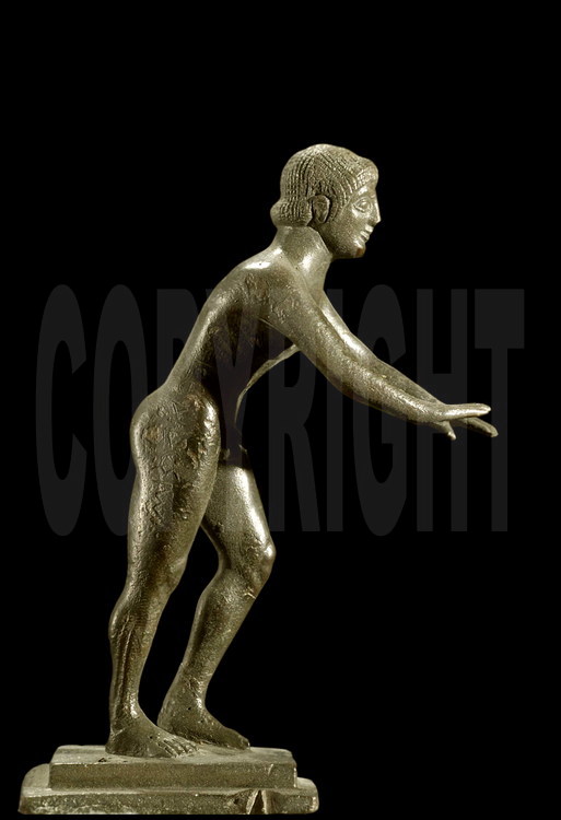 Bronze statuette representing an athlete on the starting line of the sprint (192 meters) or the diaulos (2 times192 meters). The engraved inscription on the athlete’s right thigh means “I belong to Zeus”, a nice example of symbiosis between the cult of the god and the sports competitions.  Archeological Museum of Olympia.