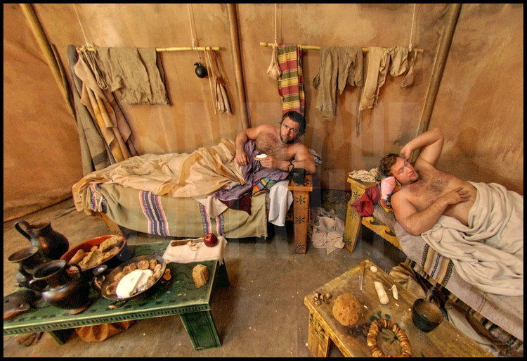 Not far from the palestra, participants stayed in a camp which identically recreated their ancestor’s living conditions.  Detlef John, left, and Richard Bleimer, right, have a copious breakfast before their morning training, as their ancestors did.