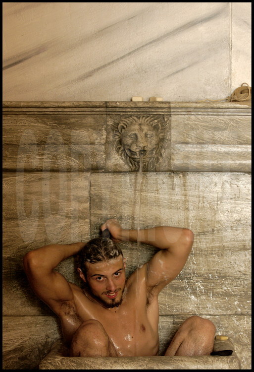 Italian wrestler Ivan Fracassi in the palestra’s baths, rebuilt as in Antiquity.