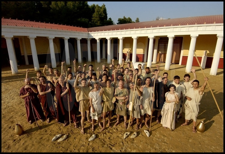 In the palestra’s courtyard, portrait of all the athletes, trainers and archaeologists (in the role of judge-referees said hellanodices) participating in competitions in the ancient stadium of Olympia.