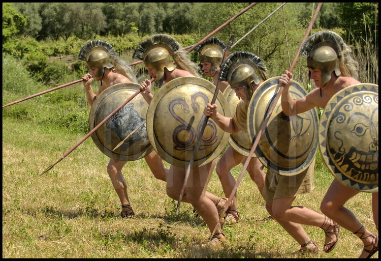 In the fields adjoining the palestra, the German team practices the start of the armed races (hoplites) which will close the Olympic games.