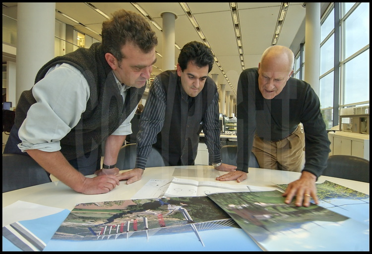 In his offices in the district of Battersea in London, Sir Lord Norman Foster and project directors Alistair Lenczner and Mouzhan Majidi are studying photographs and plans of the Viaduc de Millau.