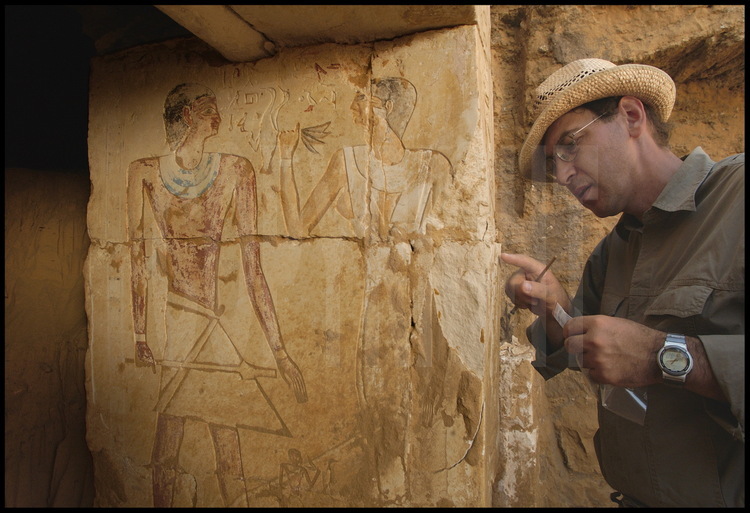 The inside right block of the entrance to Hau-Nefer’s tomb depicts the priest, on the left in red, and his wife, Khuti, on the right in yellow, bringing him offerings. Between them is their eldest son. Vassil Dobrev notes that part of the text depicting the priest’s life has been intentionally erased. The beginning of the text is still visible, and reads “Loved by Anubis, loved by Osiris, loved  by the King and their Gods…I was a…”. Then the text is gone.  Did the missing text reveal details about a contested rise to the throne by Userkare, Pepi I’s predecessor?