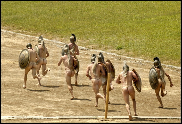Two-stadiums long (2x192m), the hoplites armed race (hiplitodromos) was open to athletes from all different sports.  The runners halfway through the race after having negotiated the bend marked by the wooden post.